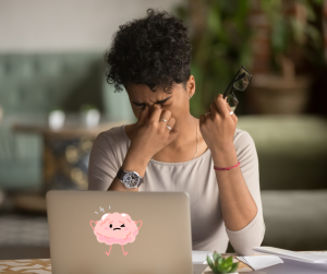 A woman at work dealing with brain fog.